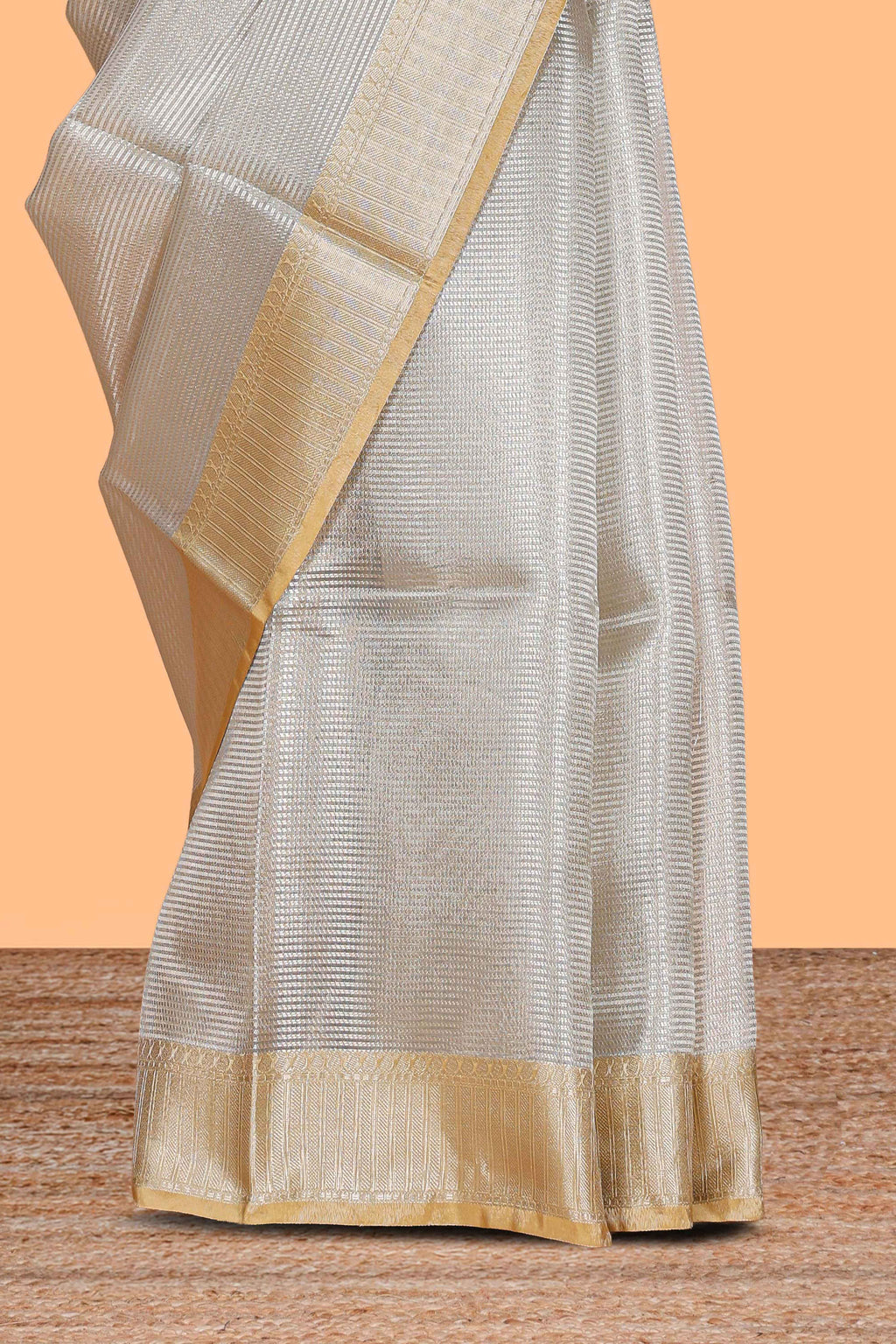 Grey zari design art tissue saree with contrast border and zari design blouse