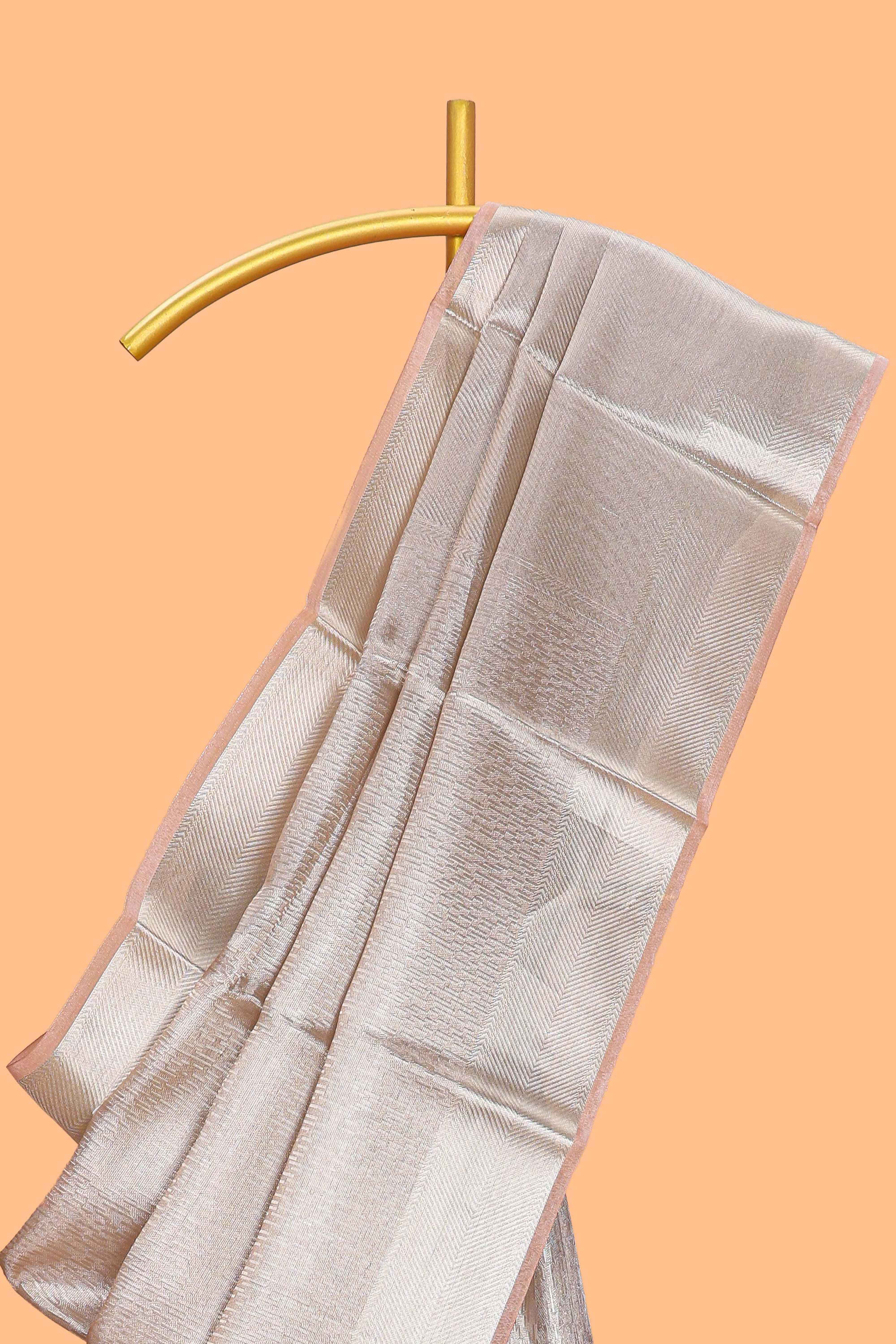 Beige geometric zari design art tissue saree with self zari border and matching blouse