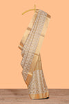 Gold shade geometric design art tissue saree with self zari border and matching blouse