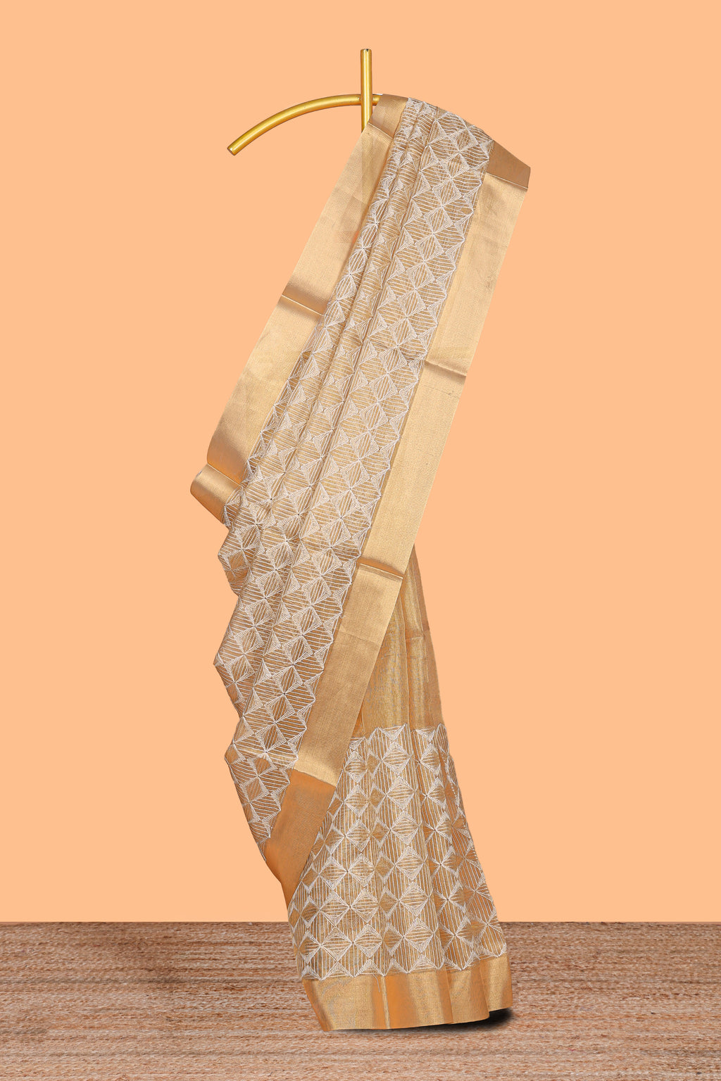 Gold shade geometric design art tissue saree with self zari border and matching blouse