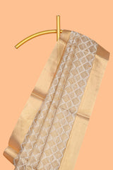 Gold shade geometric design art tissue saree with self zari border and matching blouse