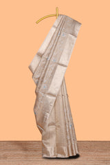 Beige color floral design are tissue saree with self zari border matching plain blouse