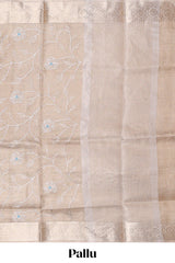 Beige color floral design are tissue saree with self zari border matching plain blouse