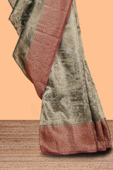 Olive green floral vine design art tissue saree with contrast zari border and blouse