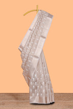 Beige floral butta art tissue saree with with self zari border and plain blouse