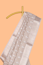 Beige floral butta art tissue saree with with self zari border and plain blouse