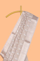 Beige floral butta art tissue saree with with self zari border and plain blouse