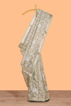 Pale green floral design art tissue saree with self zari border and plain blouse