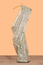 Pale green floral design art tissue saree with self zari border and plain blouse