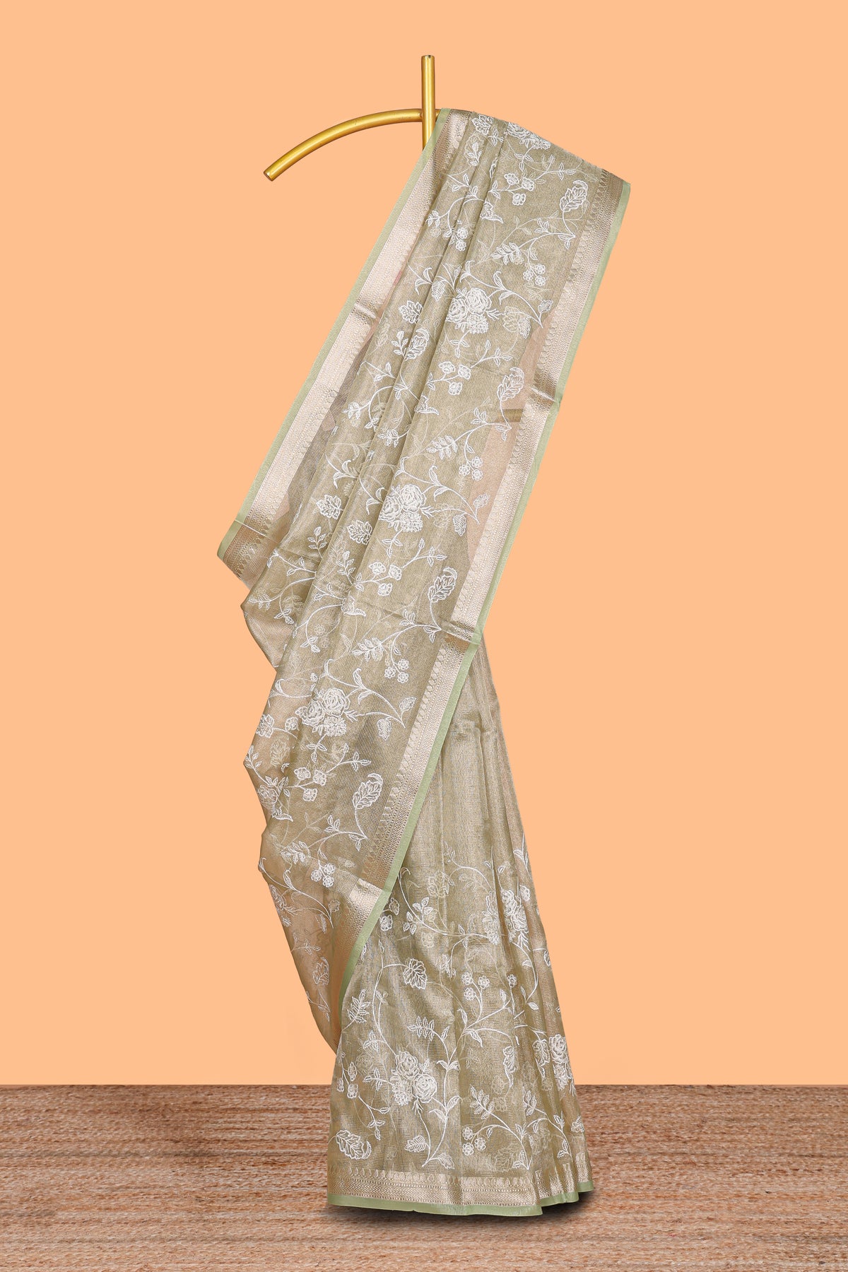 Pale green floral design art tissue saree with self zari border and plain blouse