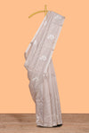 Almond beige unique design art tissue saree with flora design pallu and plain blouse