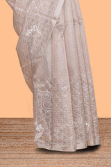 Almond beige unique design art tissue saree with flora design pallu and plain blouse