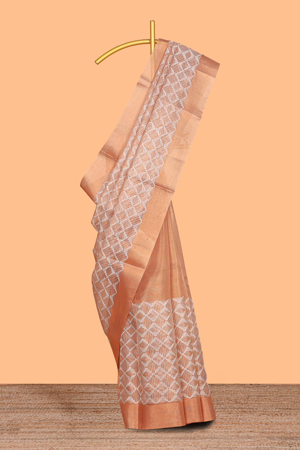 Orange geometric design art tissue saree with self zari border and plain blouse