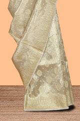 Gold color butta designs art tissue saree with zari border and plain blouse