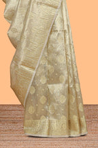 Gold color zari butta design art tissue saree with self zari border and Matching blouse