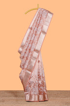 Peach floral design art tissue saree with self zari border and Matching blouse along with the floral designed pallu