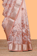 Peach floral design art tissue saree with self zari border and Matching blouse along with the floral designed pallu