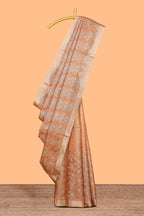 Copper geometric and floral motifs art tissue saree with self zari border and contrastr blouse