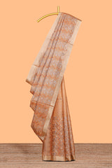 Copper geometric and floral motifs art tissue saree with self zari border and contrastr blouse