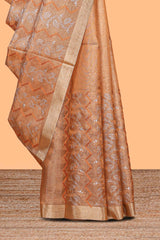 Copper geometric and floral motifs art tissue saree with self zari border and contrastr blouse