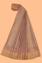 Faded peach motifs design tissue saree with contrast border and matching blouse