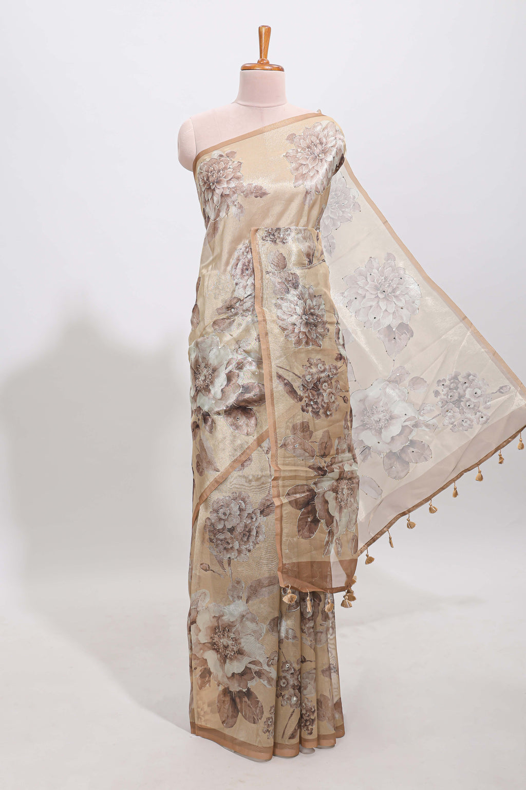 Borderless beige floral designed art tissue saree with self pallu and matching blouse