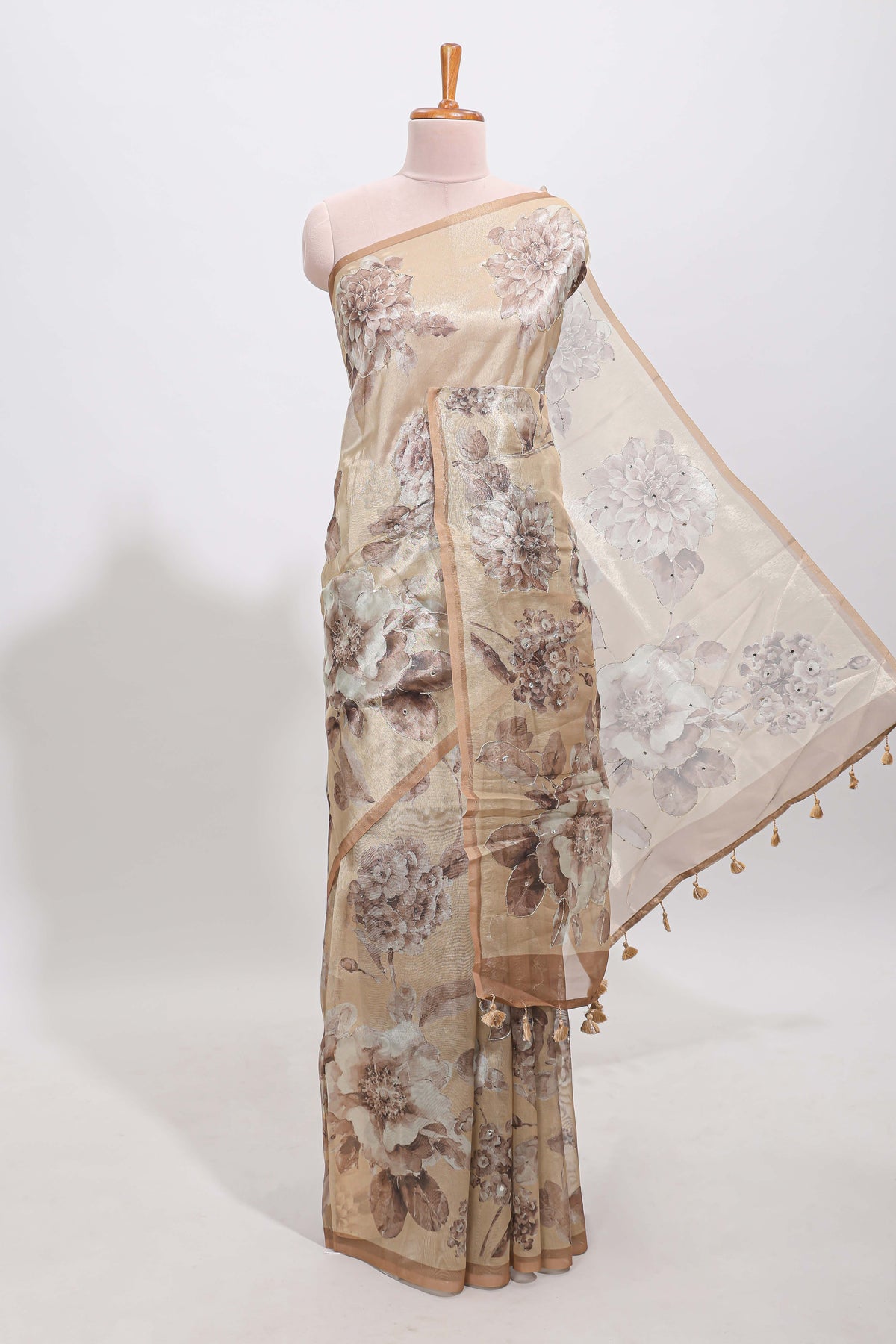 Borderless beige floral designed art tissue saree with self pallu and matching blouse