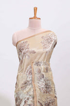 Borderless beige floral designed art tissue saree with self pallu and matching blouse