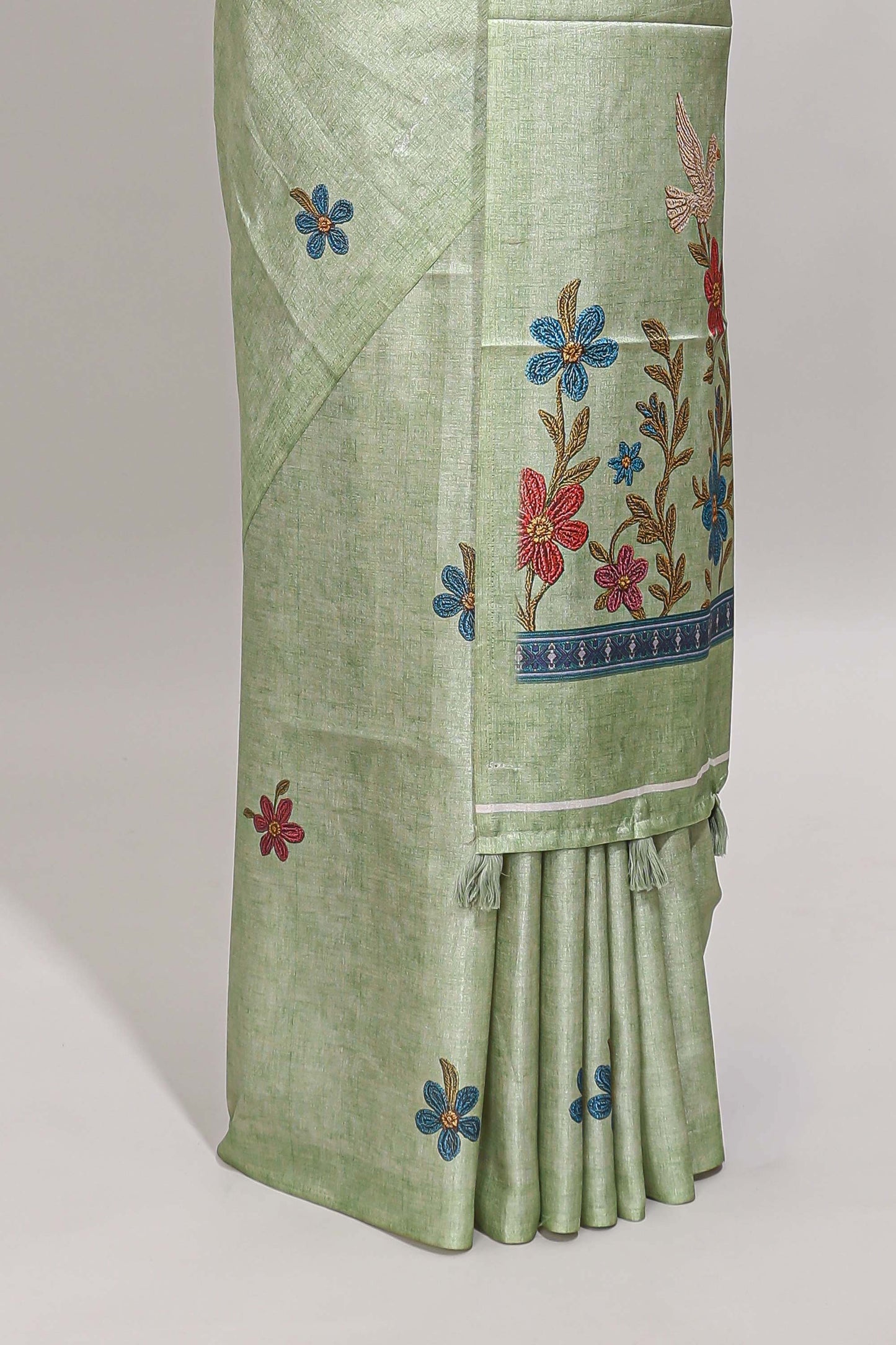 Borderless green floral motifs art tussar saree with matching blouse and floral design pallu