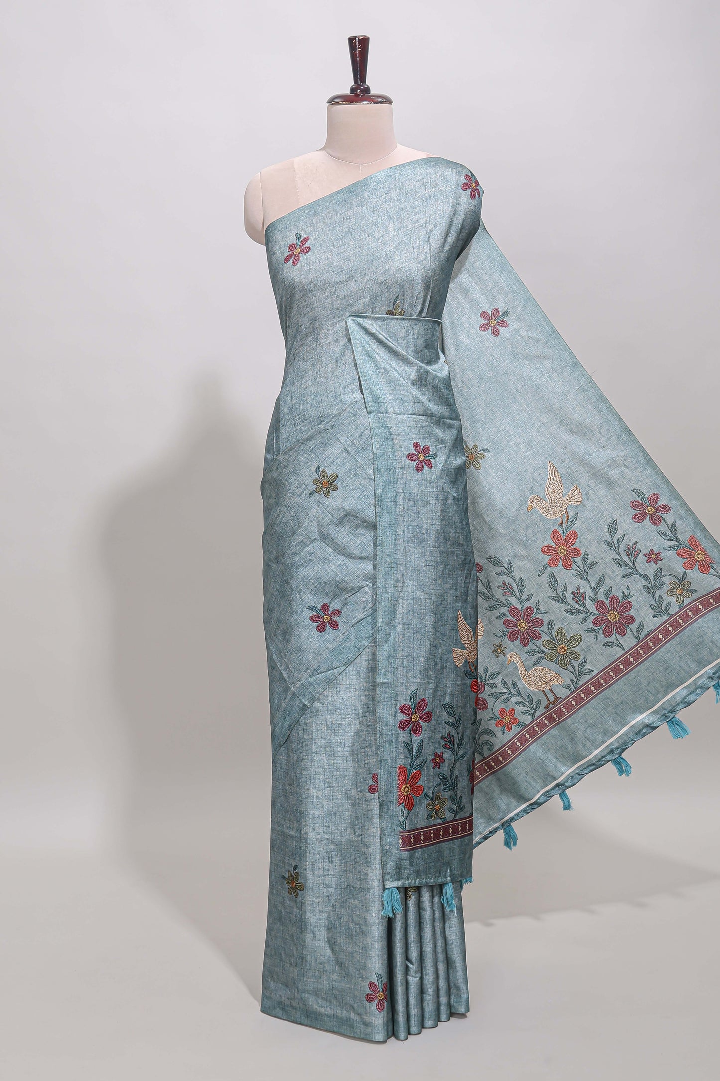 Borderless blue floral motifs art tussar saree with matching blouse and floral design pallu