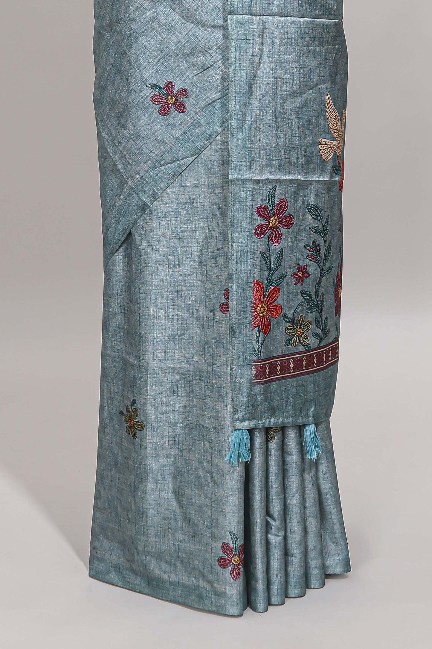 Borderless blue floral motifs art tussar saree with matching blouse and floral design pallu