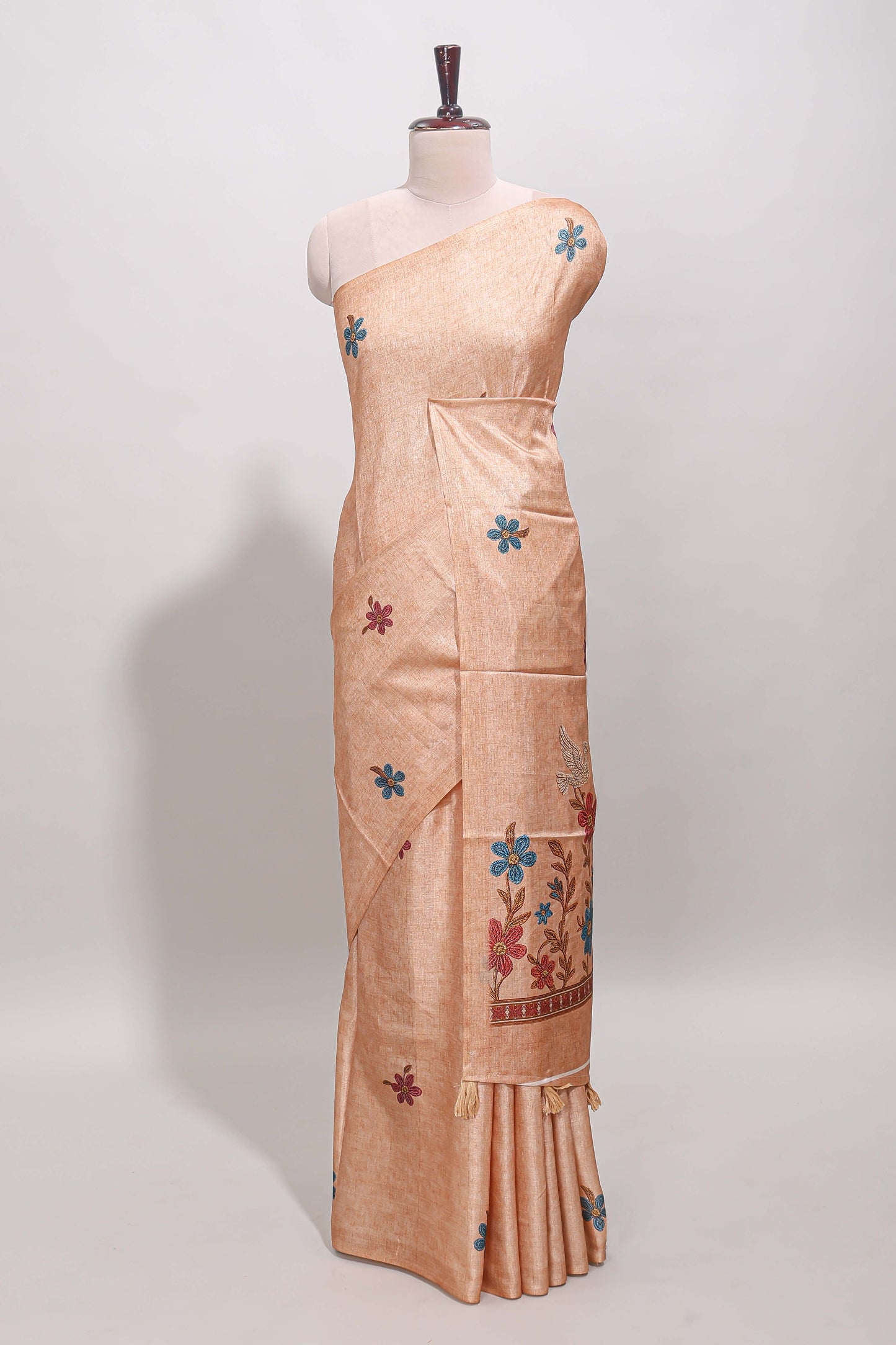 Borderless orange floral motifs art tussar saree with matching blouse and floral design pallu