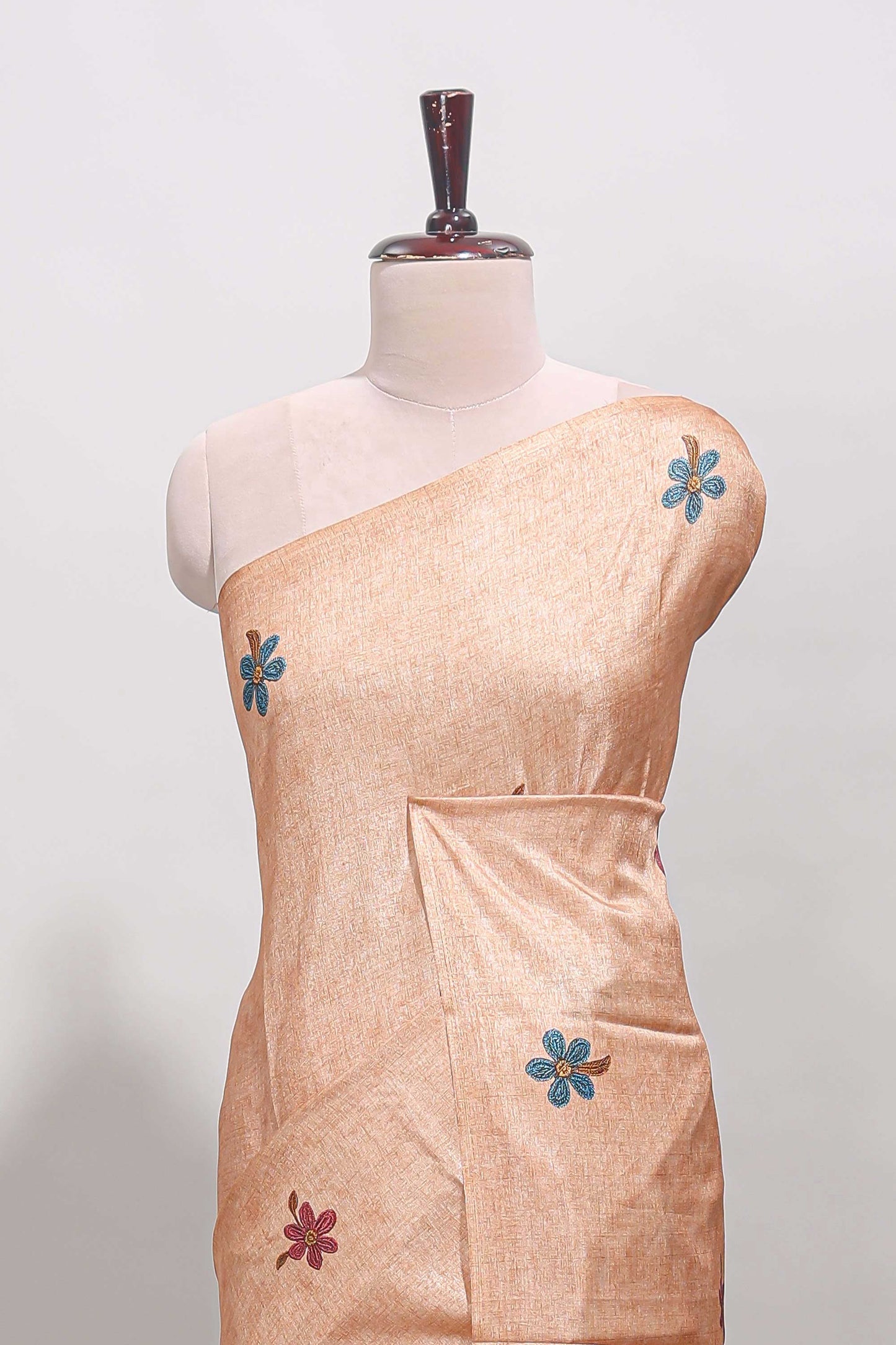 Borderless orange floral motifs art tussar saree with matching blouse and floral design pallu