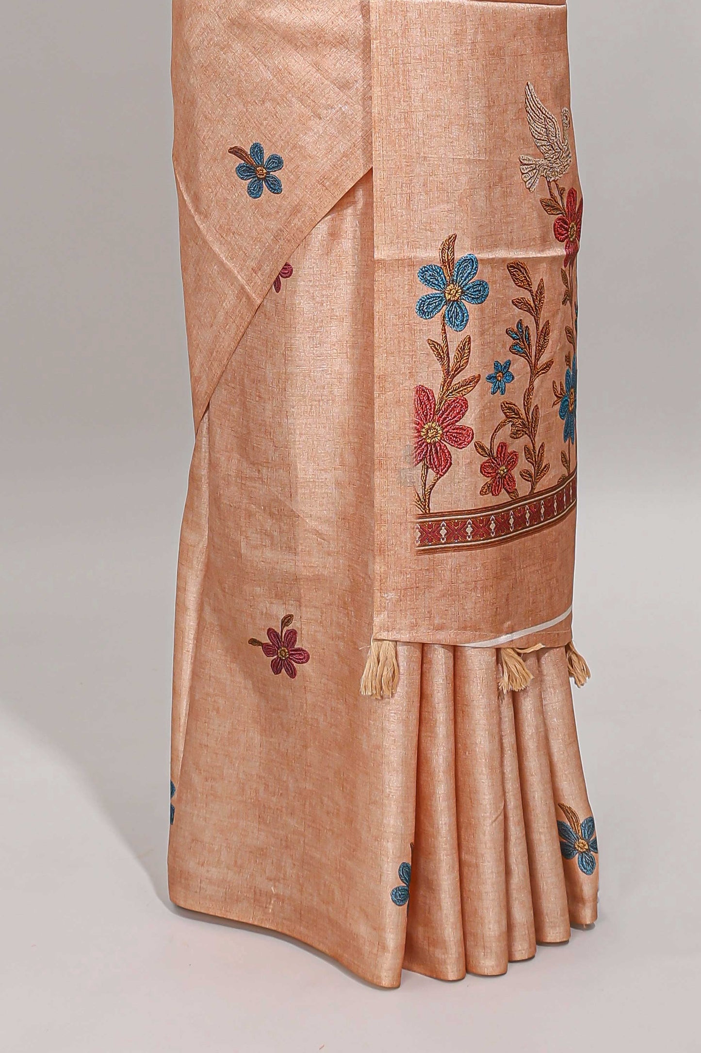 Borderless orange floral motifs art tussar saree with matching blouse and floral design pallu