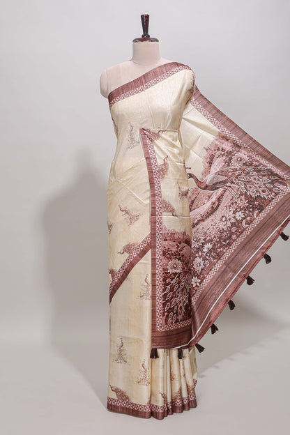 Cream peacock motifs tussar saree with contrast brown border and peacock printed pallu