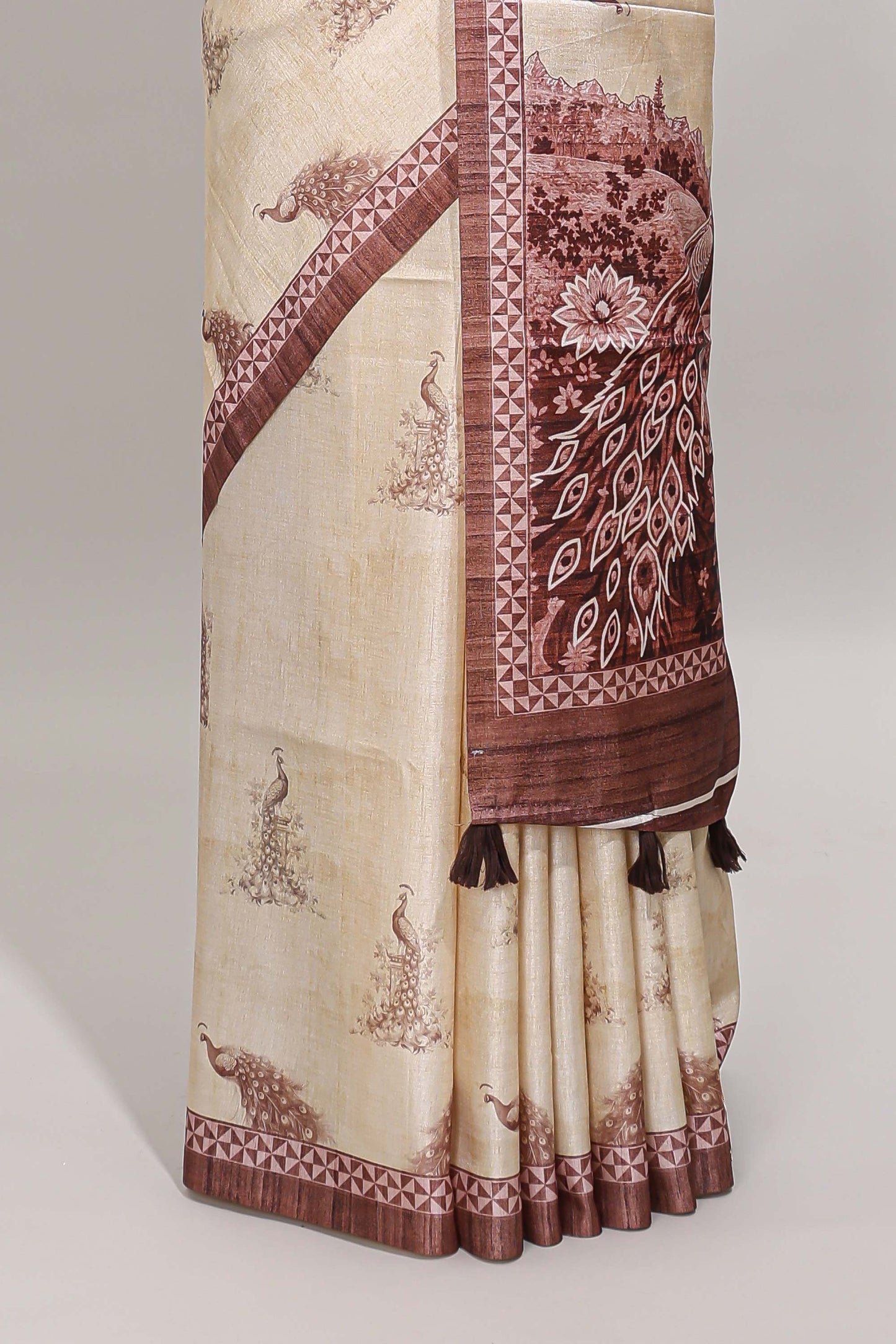 Cream peacock motifs tussar saree with contrast brown border and peacock printed pallu