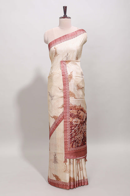 Cream peacock motifs tussar saree with contrast peach border and peacock printed pallu