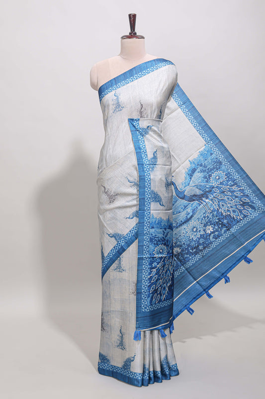 Cream peacock motifs tussar saree with contrast blue border and peacock printed pallu