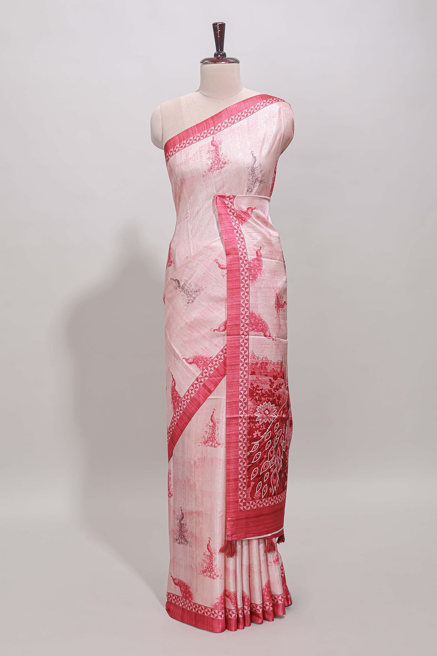 Cream peacock motifs tussar saree with contrast rani pink border and peacock printed pallu