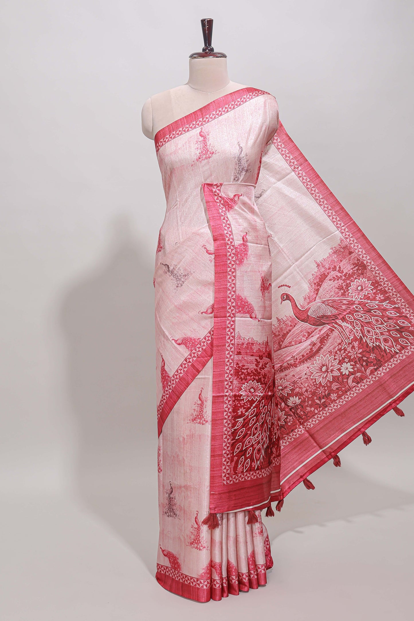 Cream peacock motifs tussar saree with contrast rani pink border and peacock printed pallu