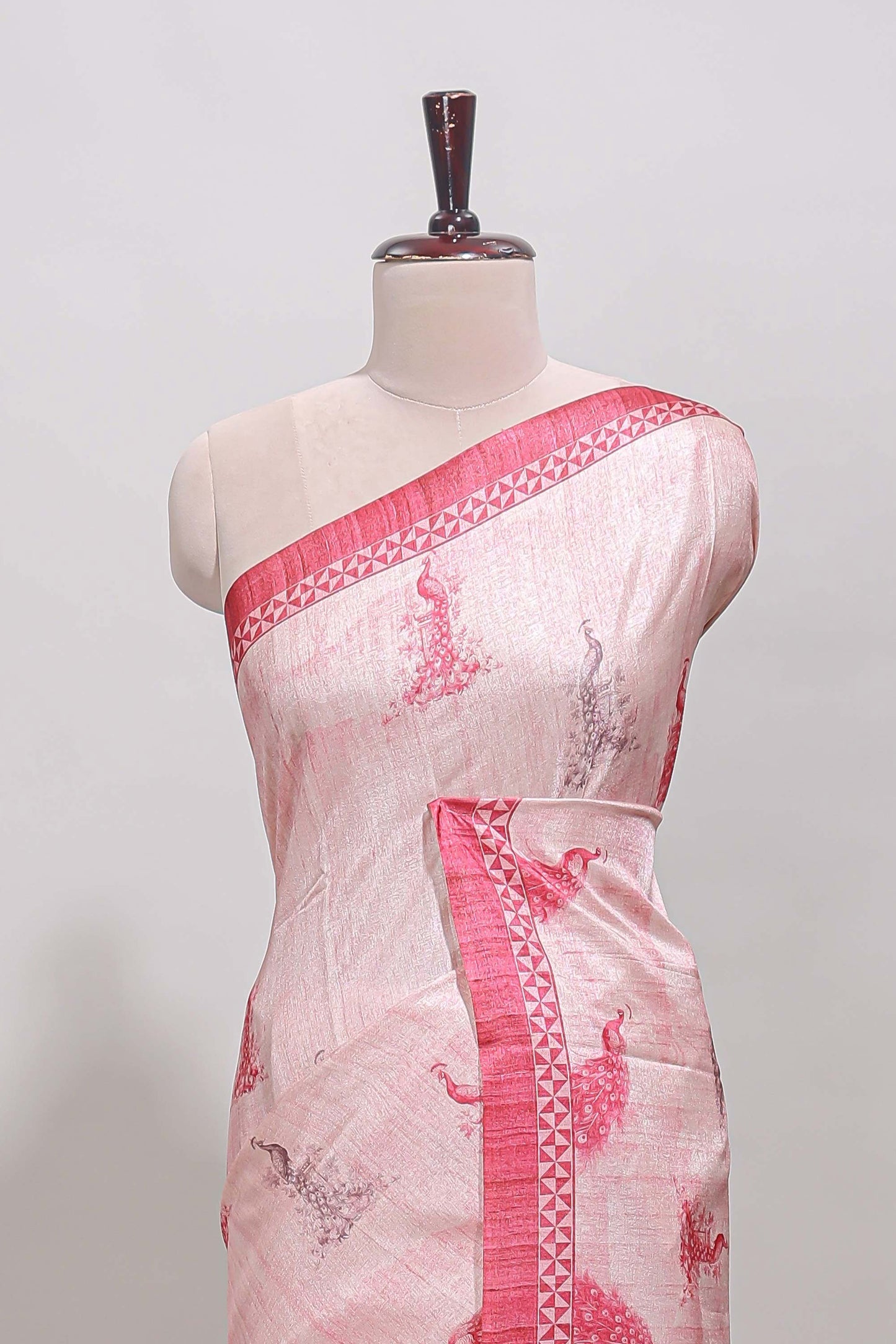 Cream peacock motifs tussar saree with contrast rani pink border and peacock printed pallu