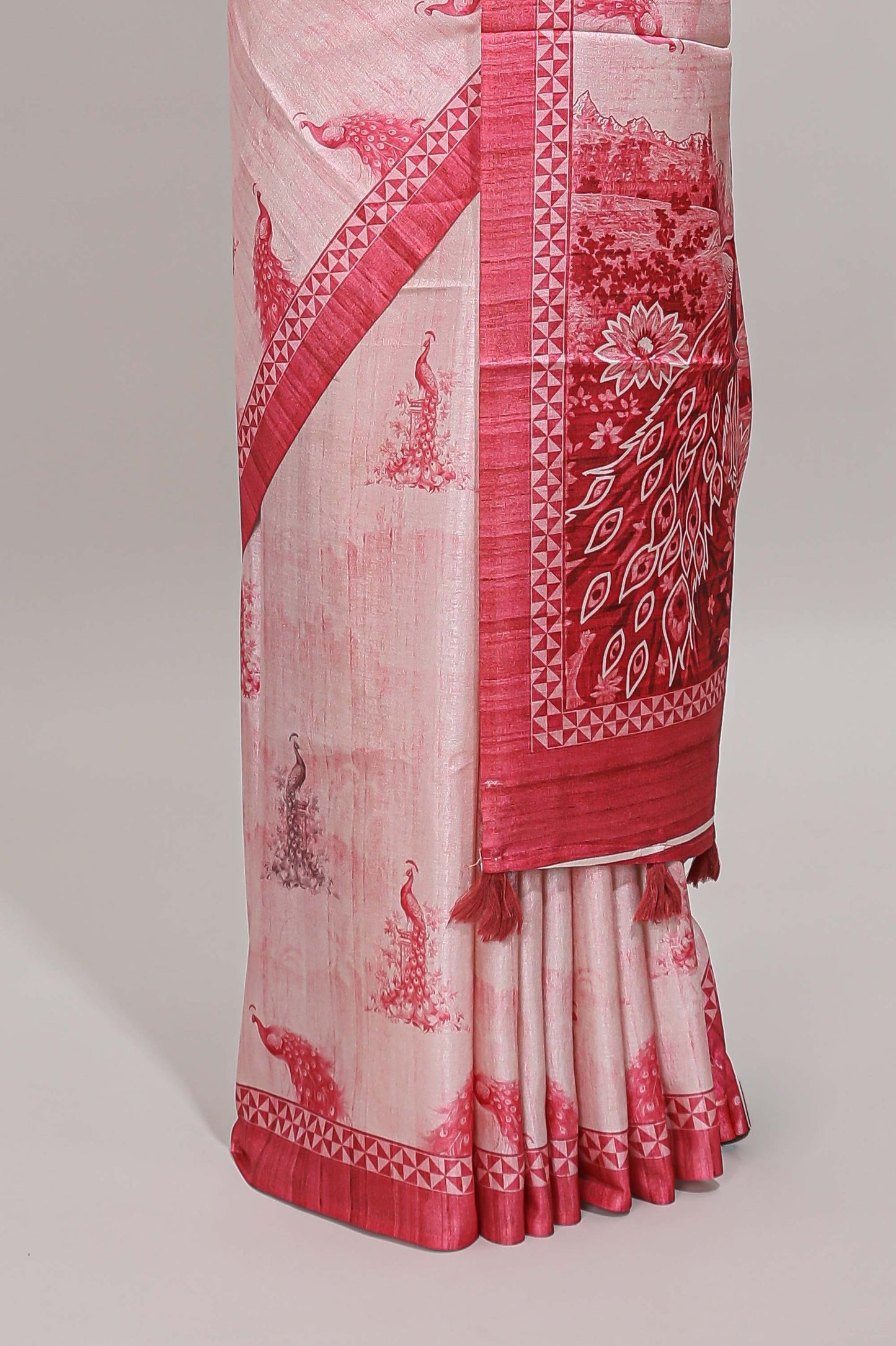 Cream peacock motifs tussar saree with contrast rani pink border and peacock printed pallu