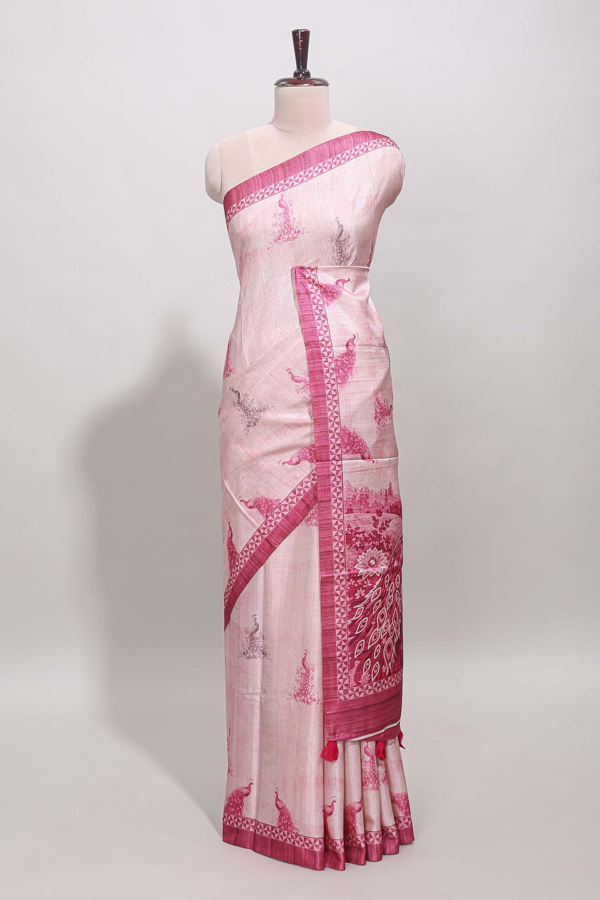 Cream peacock motifs tussar saree with contrast pink border and peacock printed pallu
