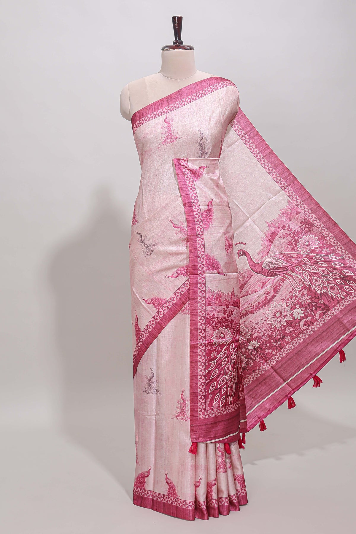 Cream peacock motifs tussar saree with contrast pink border and peacock printed pallu