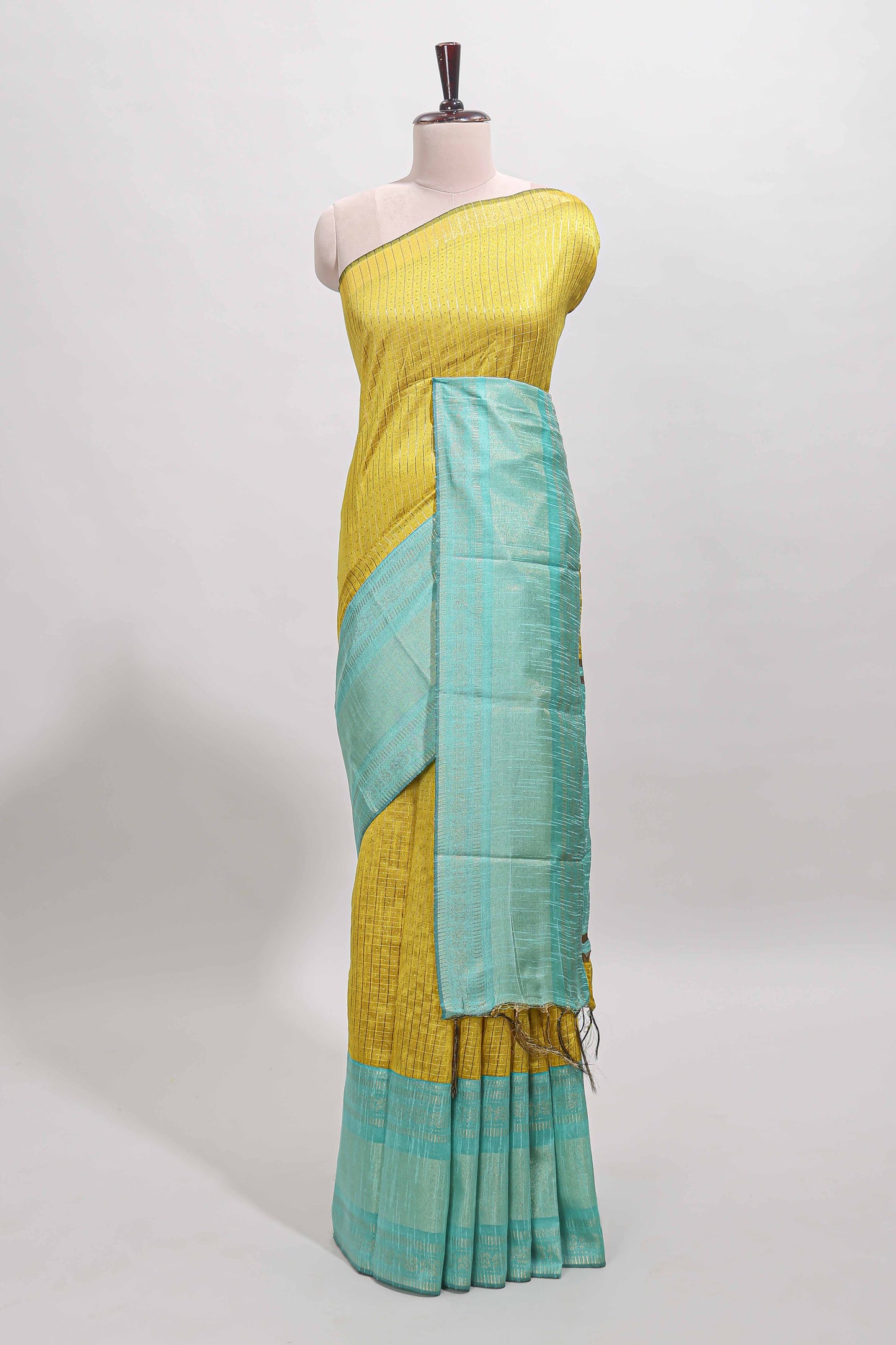 Yellow checked tussar saree with contrast blue zari border and checked blouse