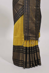 Yellow checked tussar saree with contrast black zari border and checked blouse