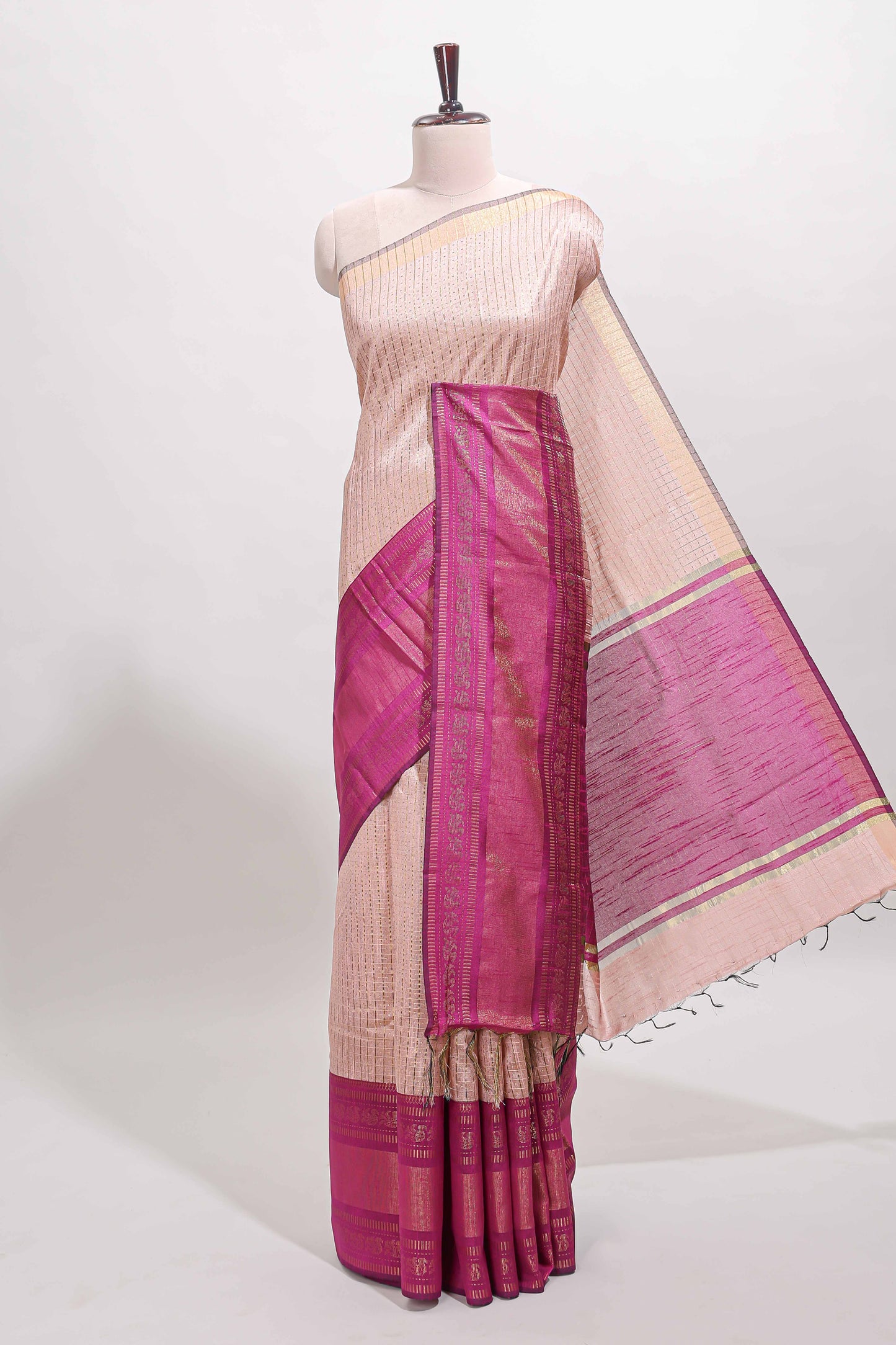 Beige checked tussar saree with contrast pink zari border and checked blouse