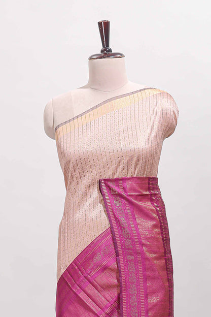 Beige checked tussar saree with contrast pink zari border and checked blouse