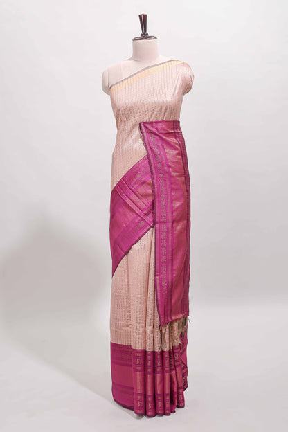 Beige checked tussar saree with contrast pink zari border and checked blouse