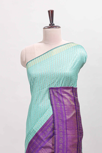 Blue checked tussar saree with contrast violet zari border and checked blouse